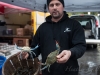 fisherman with fresh cut crabs Union Square Greenmarket - NYC